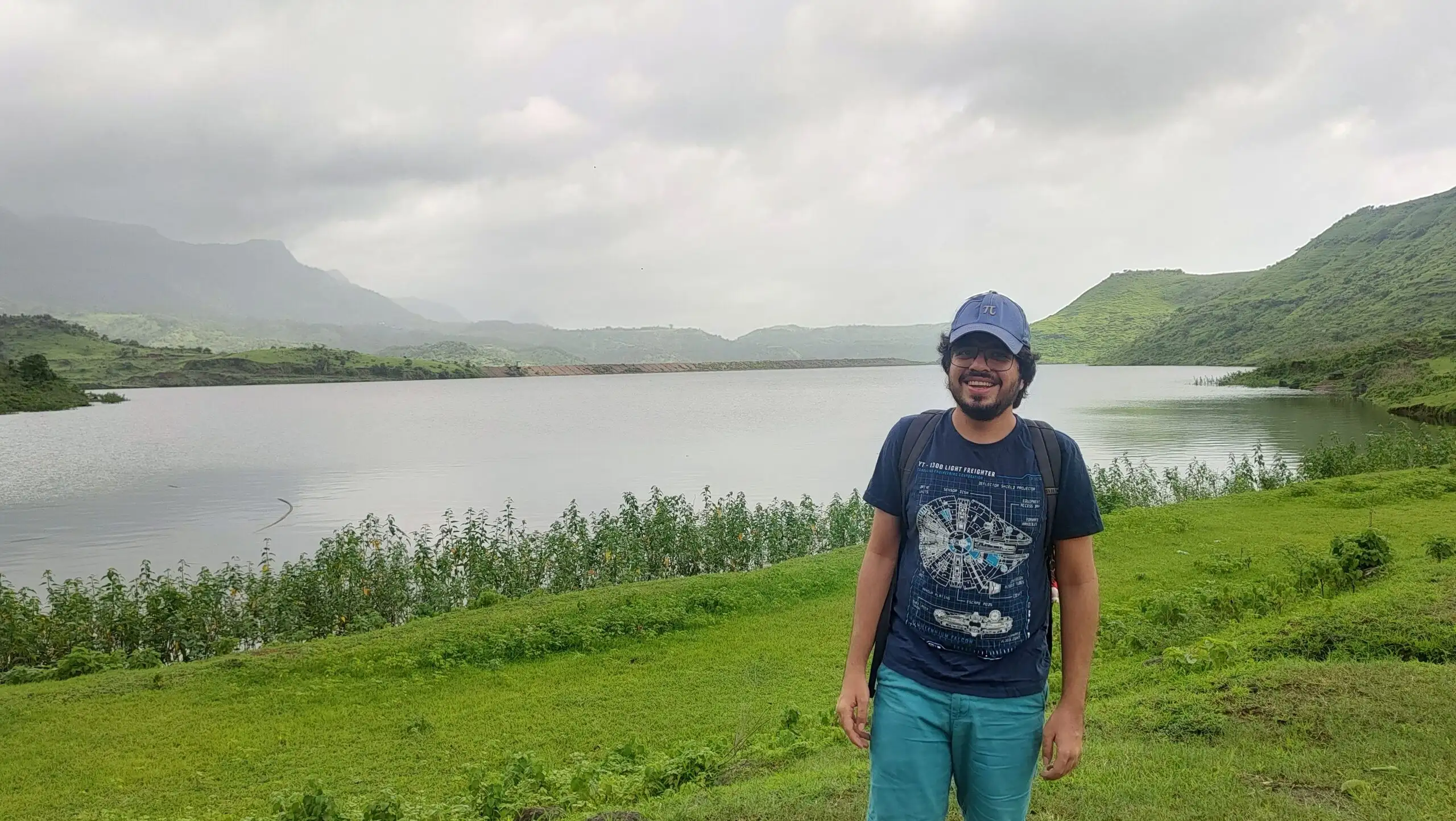 Me standing in front of real mountains and a lake