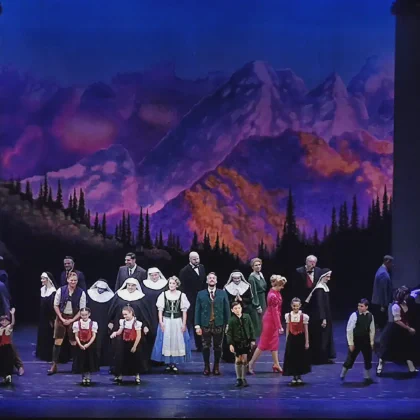The cast of The Sound of Music bowing on stage