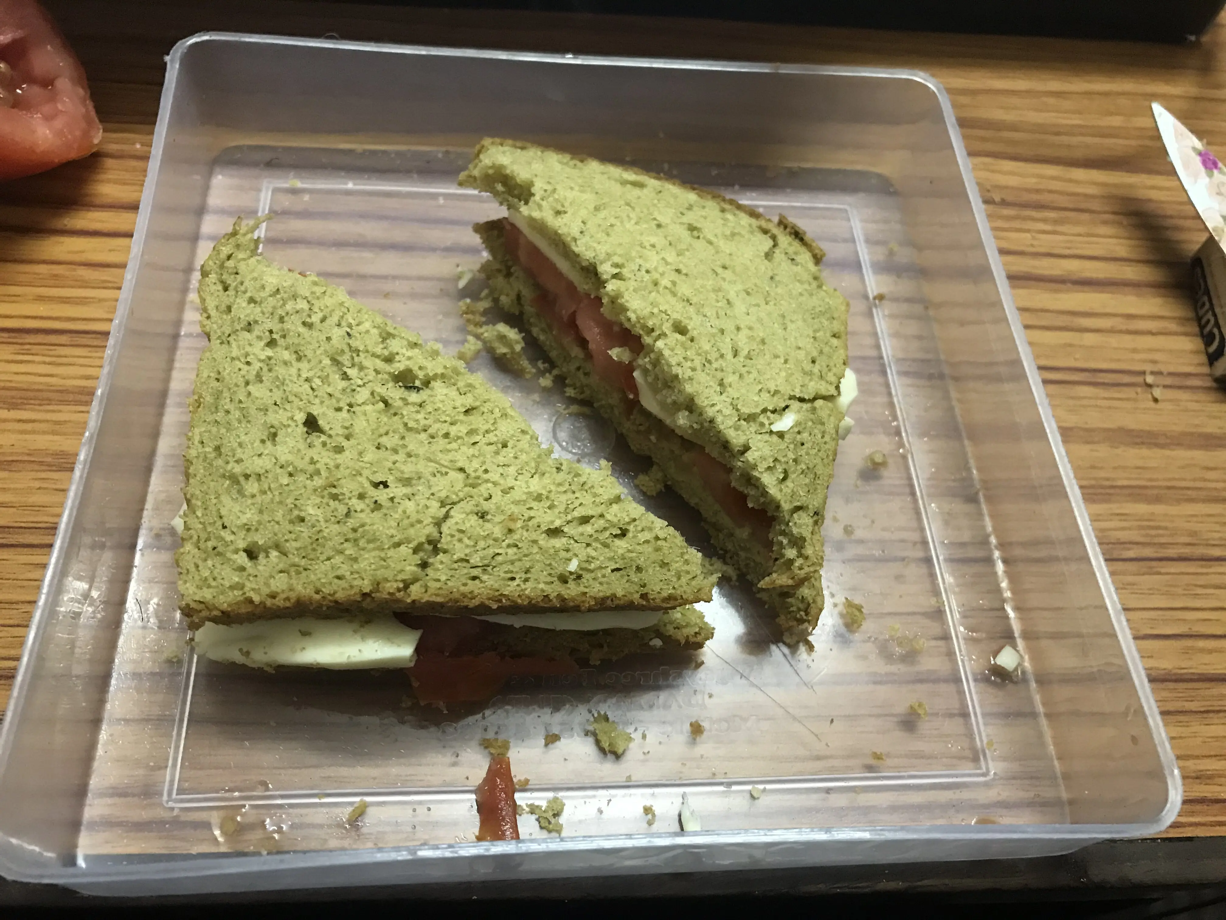 Starfruit sandwich cut diagonally into two triangular pieces