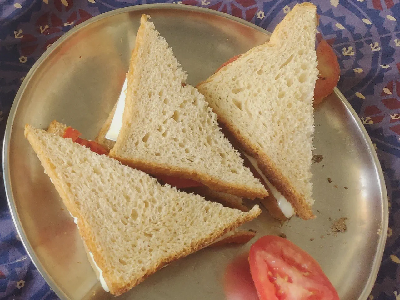 Tomato cheese sandwiches, cut and ready-to-eat.