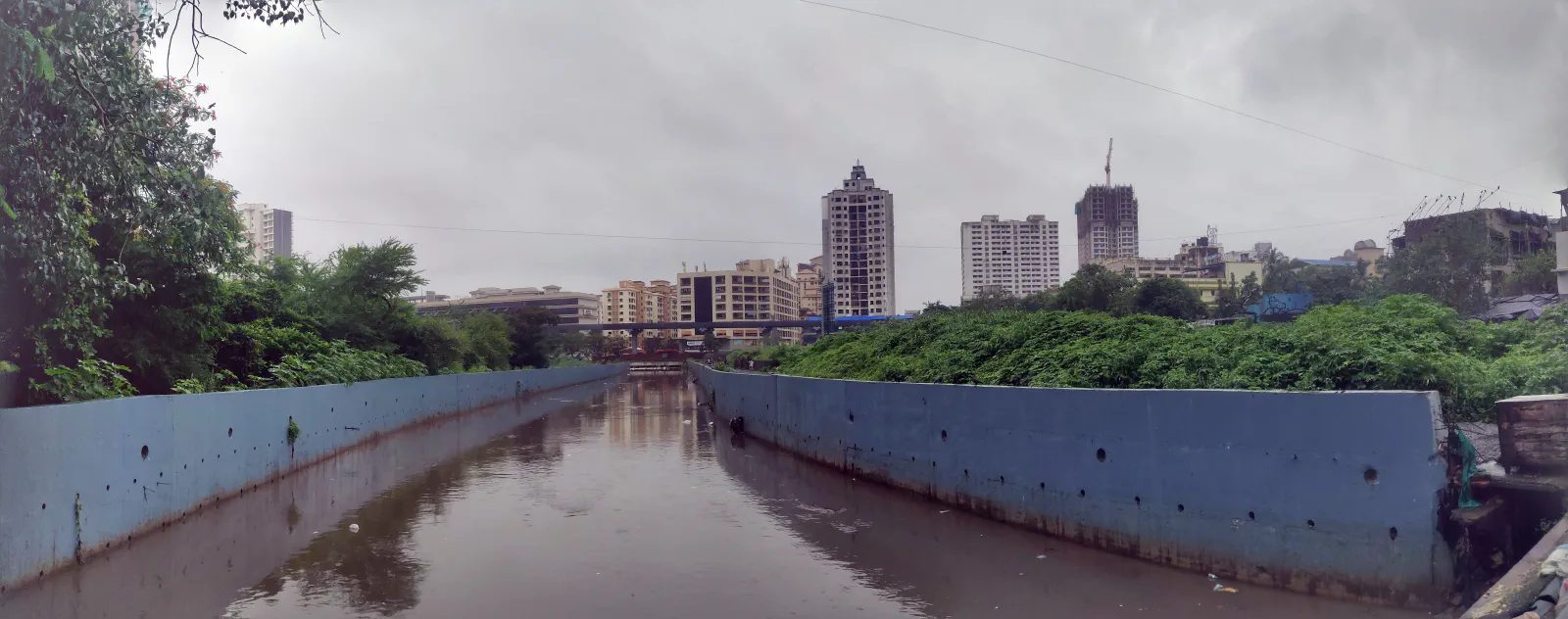 A water channel, with buildings in the background.