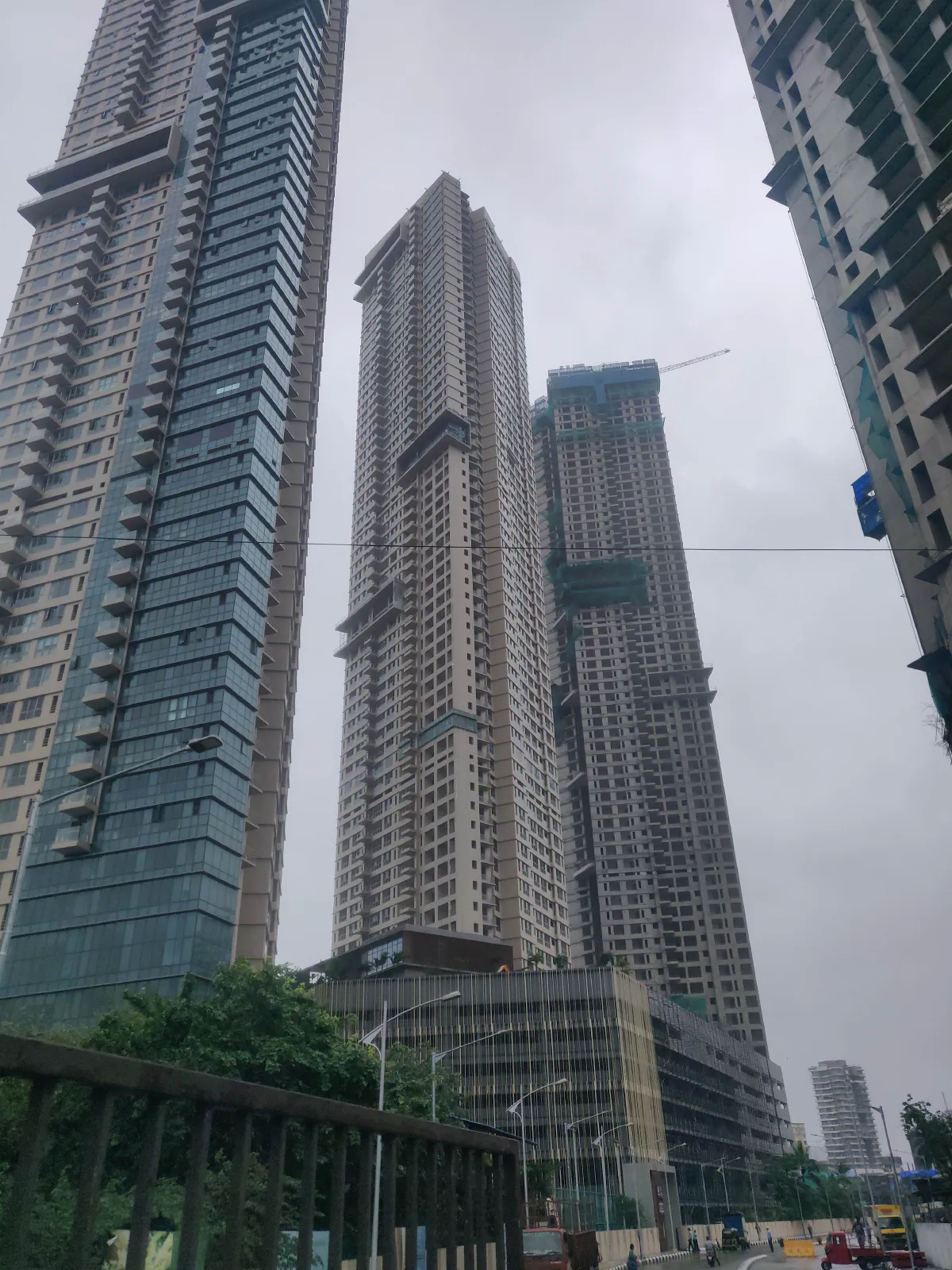Three tall towers under construction.