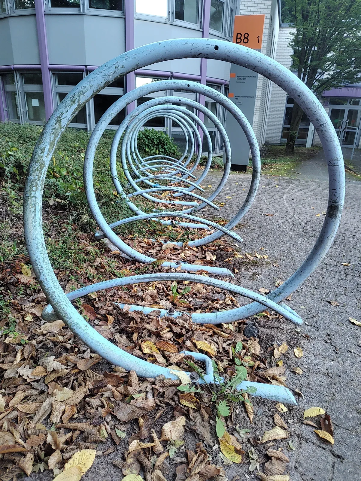 A side view of a metal structure for parking cycles.