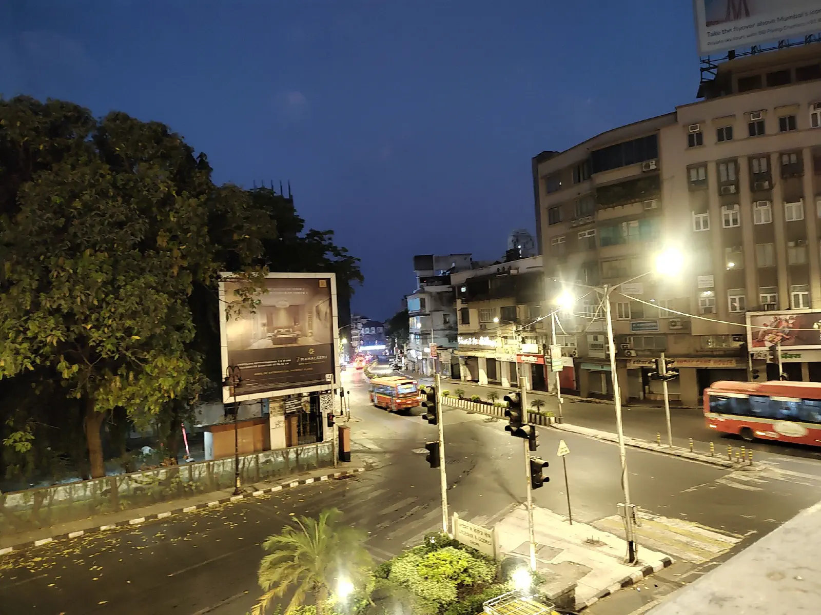 Buses ply along at Godrej chowk.
