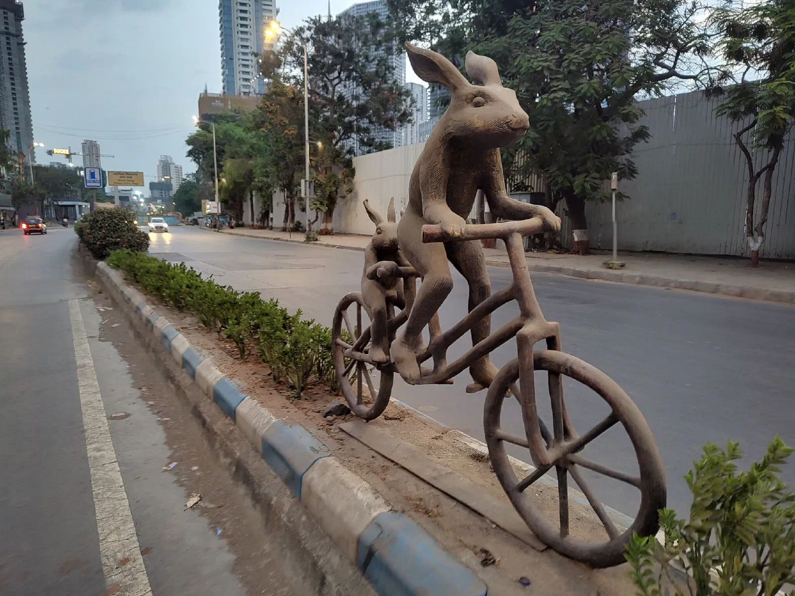Side view of the two bunnies on the tandem cycle. 
