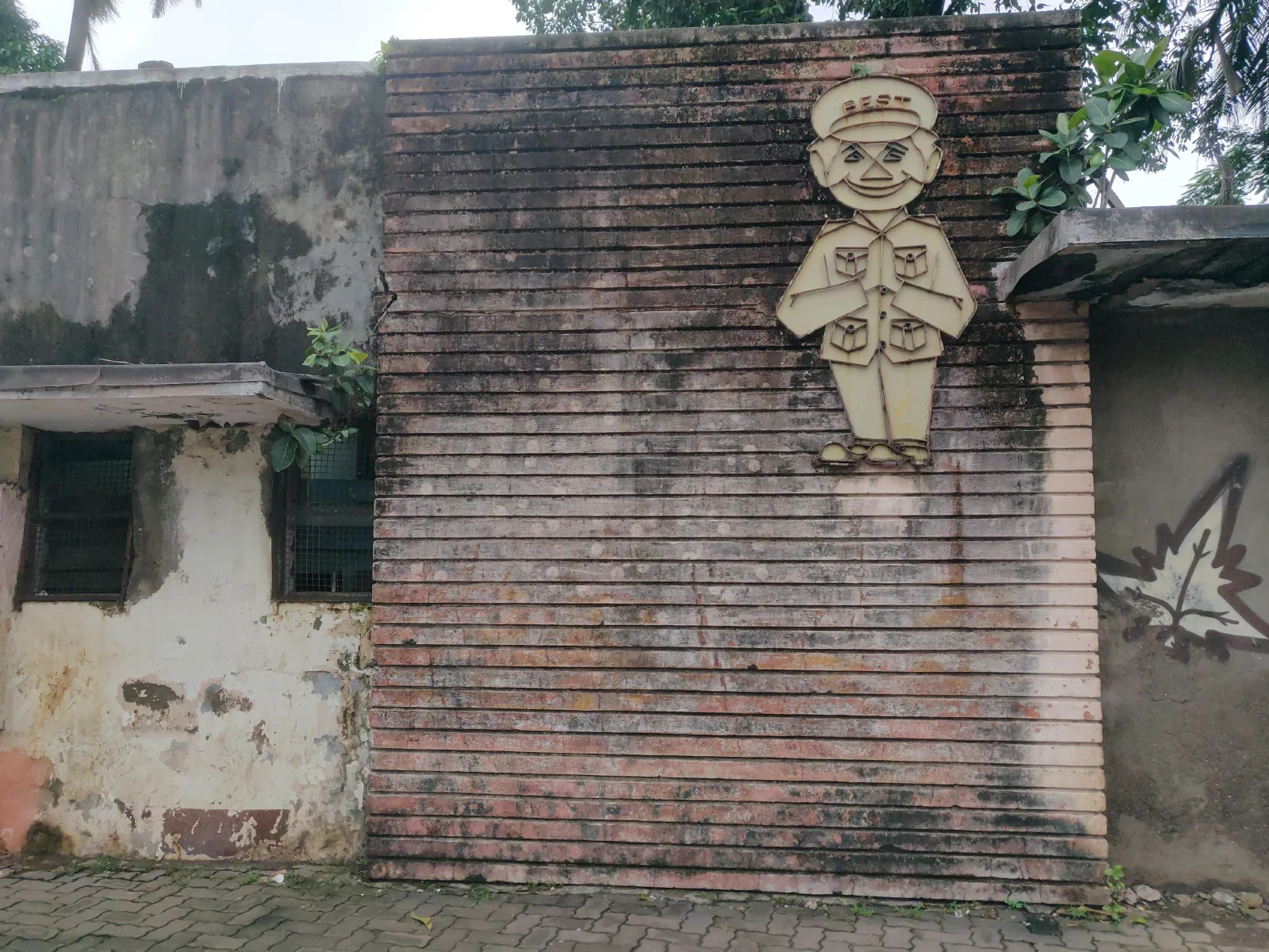 An illustration on a wall of a man in BEST uniform